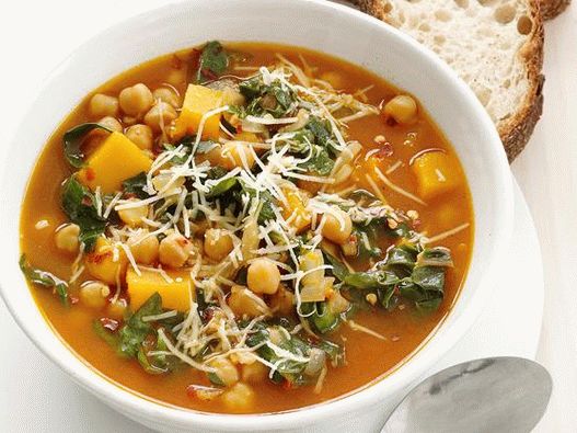 Foto ensopado de legumes com abóbora e grão de bico em uma panela lenta