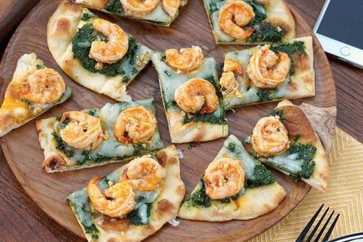 Photo Pizza com pesto de couve couve e camarão scampi