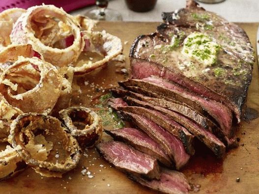 Photo Steak London grelha com manteiga e verduras